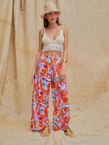 Wave-patterned wide-leg pants paired with a solid-colored shirt