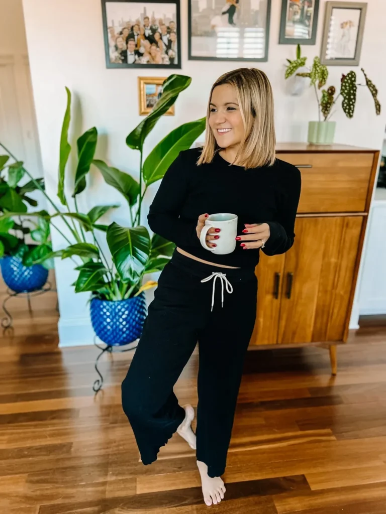 Mate the Label model wearing neutral pajamas holding a coffee ucp