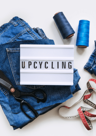 upcycle your old clothes with Denim Upcycling Ideas using Old Jeans: Repurposing and Reusing with Upcycle Clothes, Upcycle Fashion, and Upcycle Old Clothes. Lightbox with Text Upcycling, Stack of Old Blue Jeans, Scissors, Thread, and Sewing Tools in Sewing Studio.