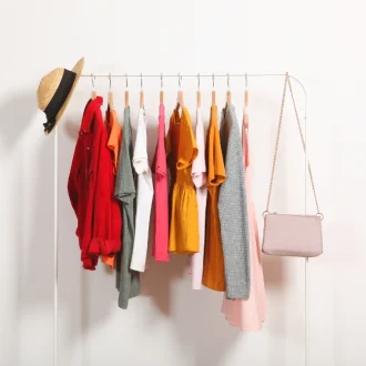 A neatly organized capsule wardrobe showcasing a reduced collection of clothing items, illustrating effective capsule wardrobe tips for creating a versatile and timeless style.
