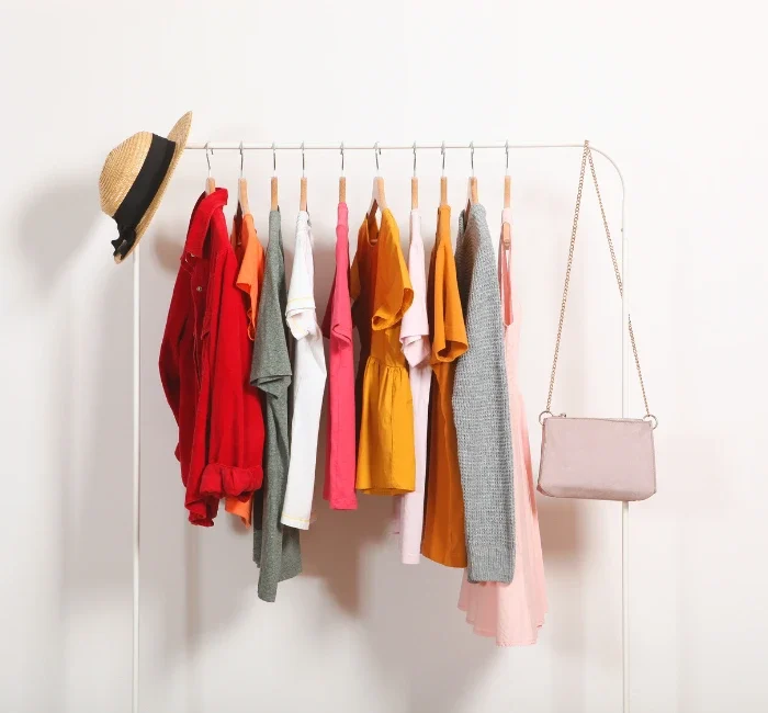 A neatly organized capsule wardrobe showcasing a reduced collection of clothing items, illustrating effective capsule wardrobe tips for creating a versatile and timeless style.