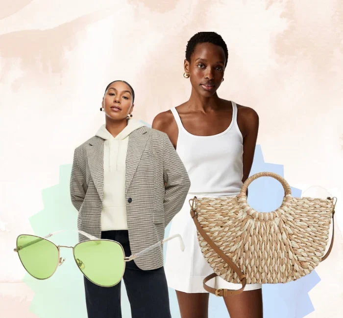 Two women showcasing pieces from a minimalist summer wardrobe. One wears an oversized blazer with a hoodie and trousers, while the other models a white tank dress. Accessories include green-tinted sunglasses and a straw tote bag.