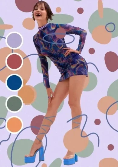 A woman dressed in a vibrant, multicolored outfit stands against a background of abstract patterns. The image showcases the practical application of color theory in fashion. The woman’s outfit features shades of blue, green, and orange, demonstrating how different colors can be harmonized to create a stylish look.