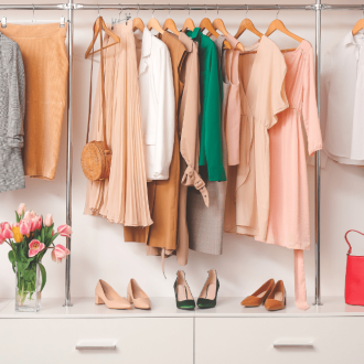 Modern wardrobe featuring stylish spring clothes and accessories, arranged using how to organize your closet tips