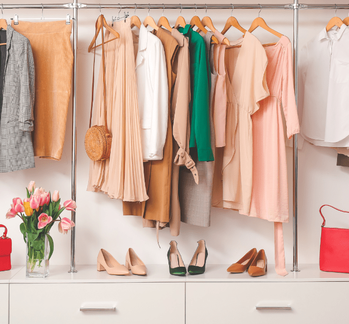 Modern wardrobe featuring stylish spring clothes and accessories, arranged using how to organize your closet tips