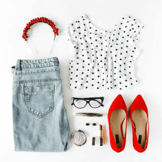 A captivating collage of chic feminine attire and accessories, artfully arranged in a flat lay composition on a pristine white backdrop. This stylish ensemble, featuring a blouse, jeans, sleek eyewear, lush mascara, bold lipstick, fiery red high heels, and dazzling earrings and hoops, creates a harmonious fusion of match outfits, perfect for any fashion-forward woman.